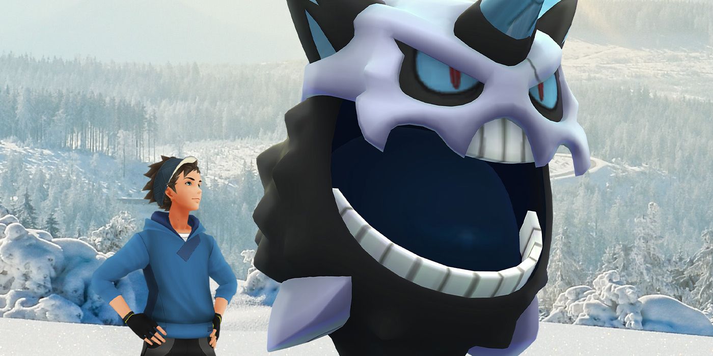 A Pokémon GO trainer standing in a snowy forest next to a Mega Glalie.