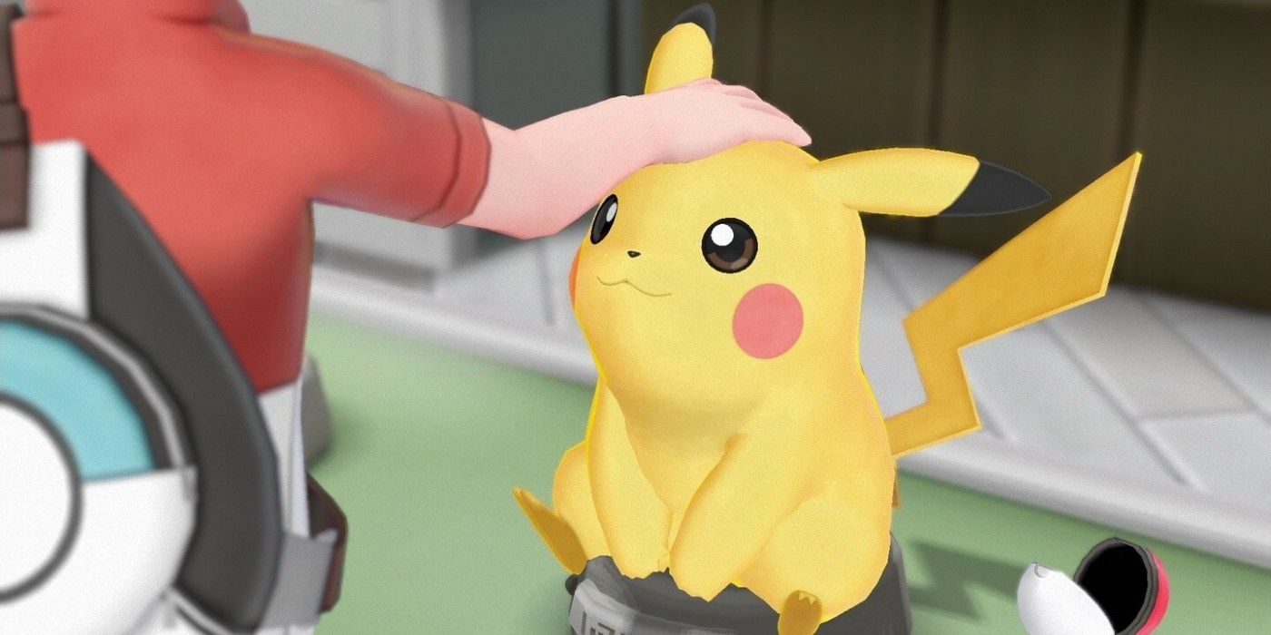 O treinador acariciando Pikachu em Pokémon: Let's Go Pikachu!