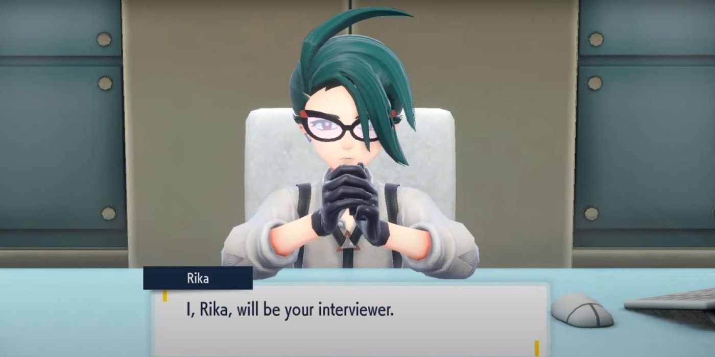 A blue haired woman sits in front of a beige background and has her elbows on a blue desk. She is wearing black glasses with a red tip, a white shirt with black overalls, and black gloves. She is saying "I, Rika, will be your interviewer"