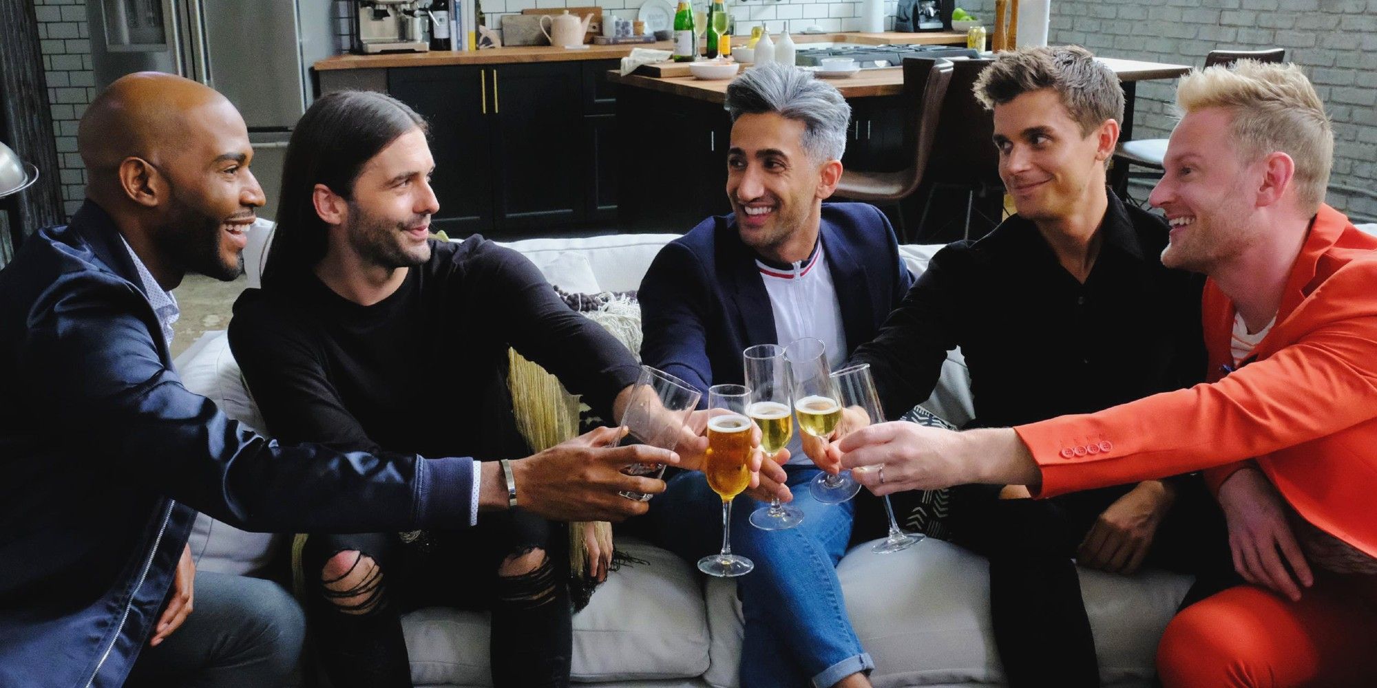 The Fab Five toast with champagne on Netflix's Queer Eye.