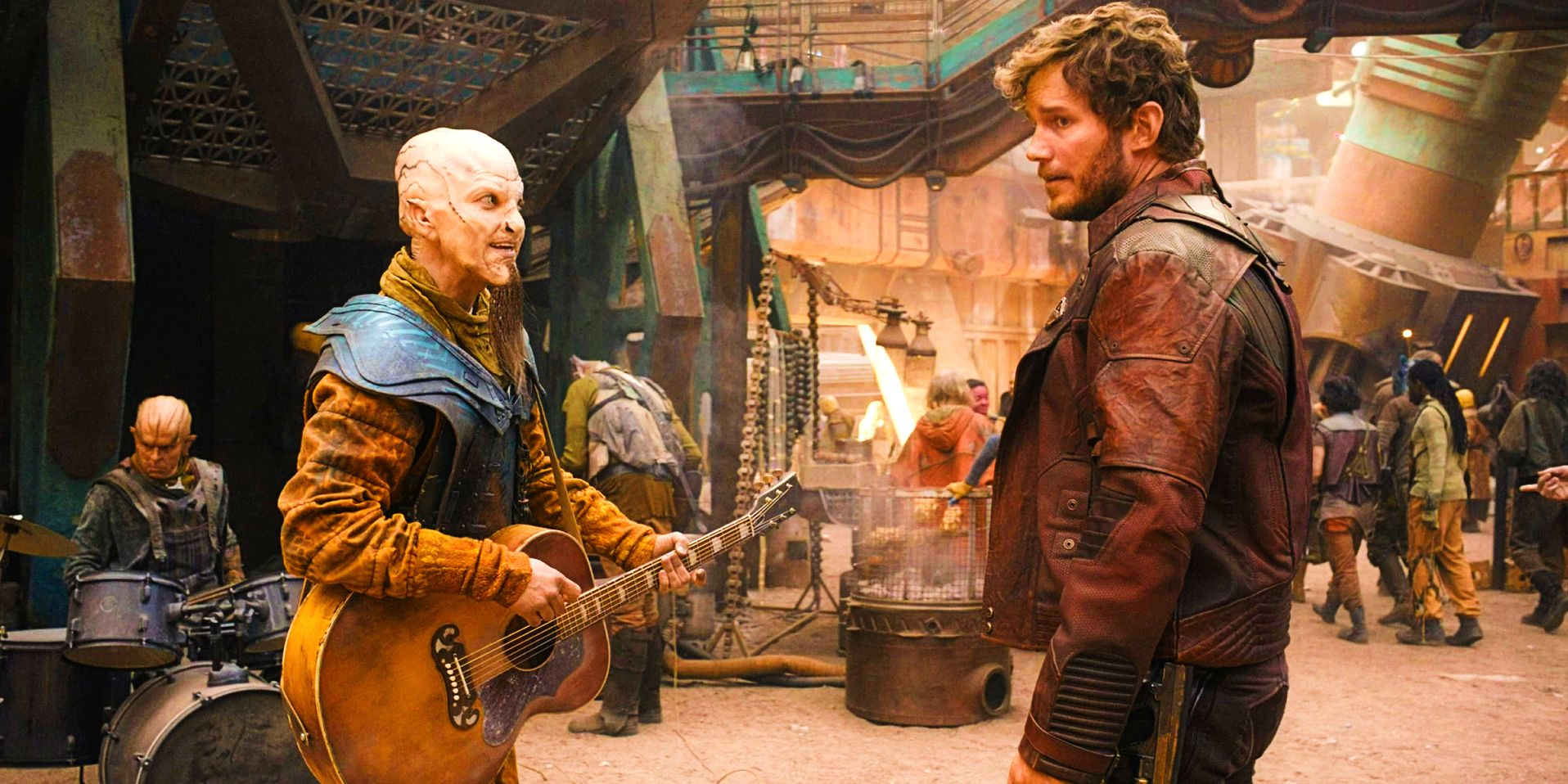 Rhett Miller as Bzermikitokolok playing guitar and singing to Chris Pratt as Peter Quill Star-Lord in The Guardians of the Galaxy Holiday Special