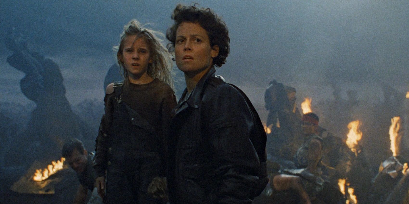 Ripley_and_Newt_stand_before_wreckage_in_Aliens