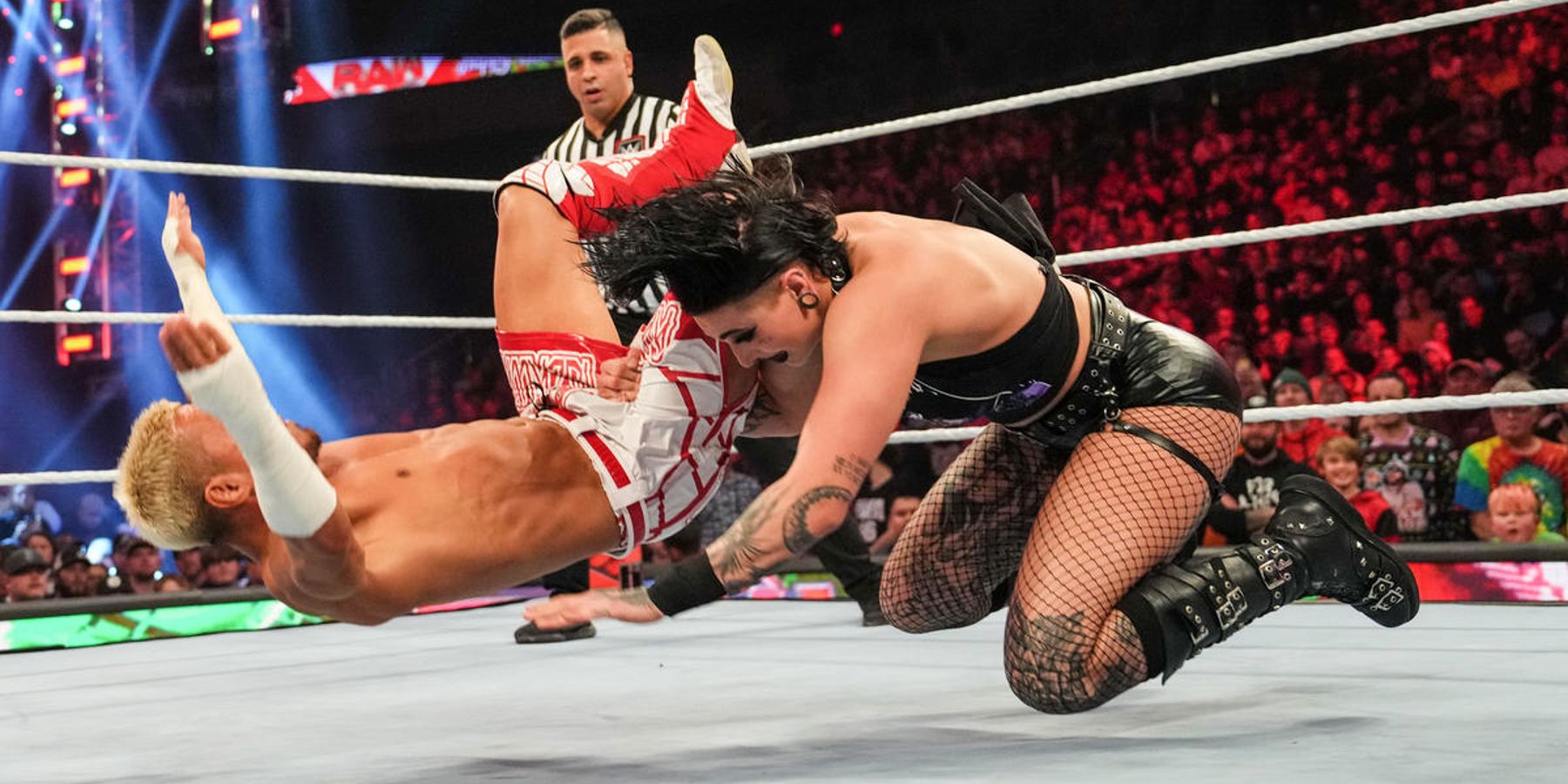 Rhea Ripley delivers a crushing blow to Akira Tozawa during their match on WWE Raw in 2022.