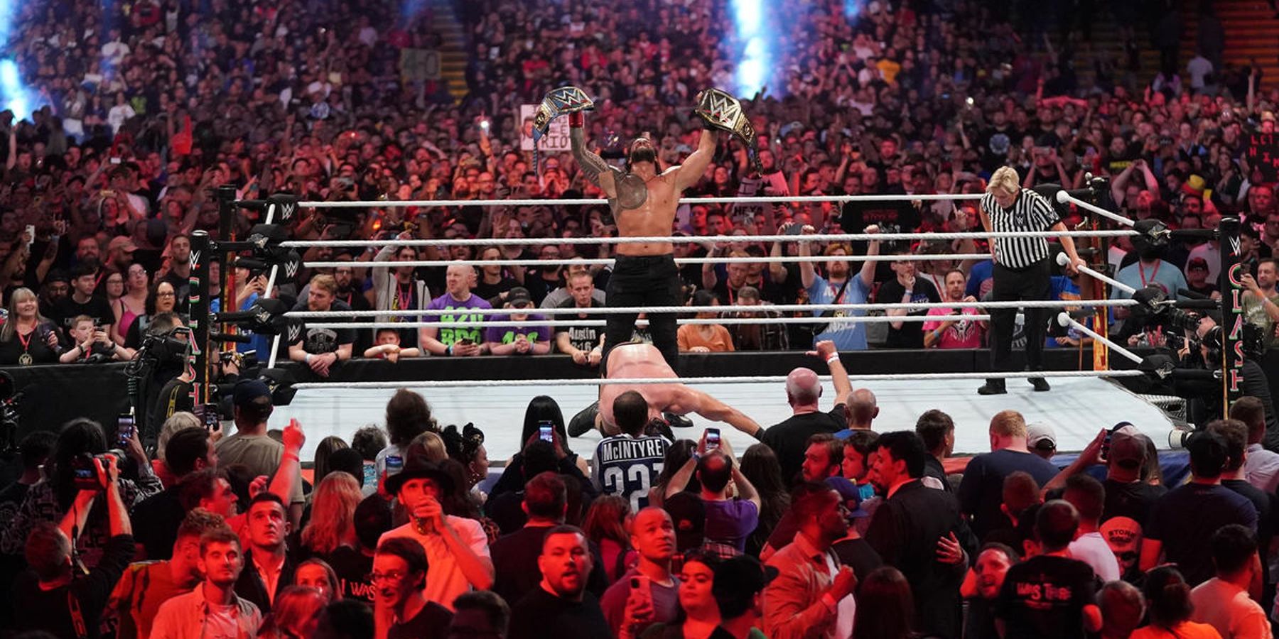 Roman Reigns celebrates his win over Drew McIntyre at WWE Clash At The Castle in 2022.