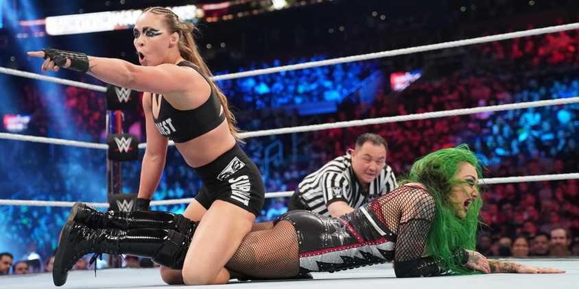 Ronda Rousey prepares to lock Shotzi into a leg submission during a match at WWE Survivor Series.