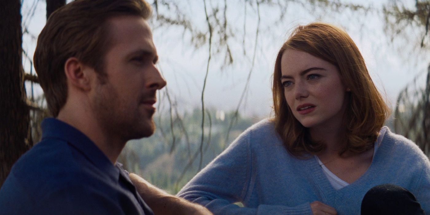 Ryan Gosling as Seb and Emma Stone as Mia sitting outside in La La Land