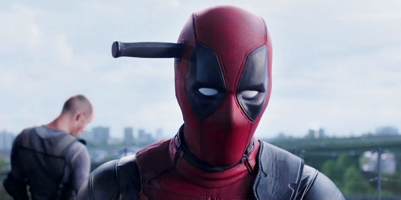 Deadpool with a knife stuck in the side of his head.