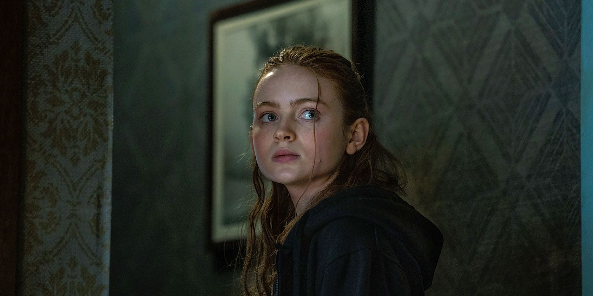 Sadie Sink as Ellie looks over her shoulder in The Whale