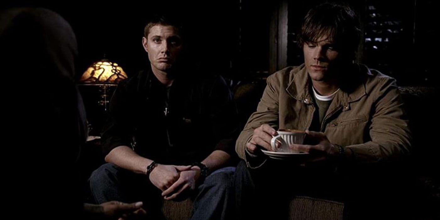 Sam and Dean sitting on a couch in Supernatural