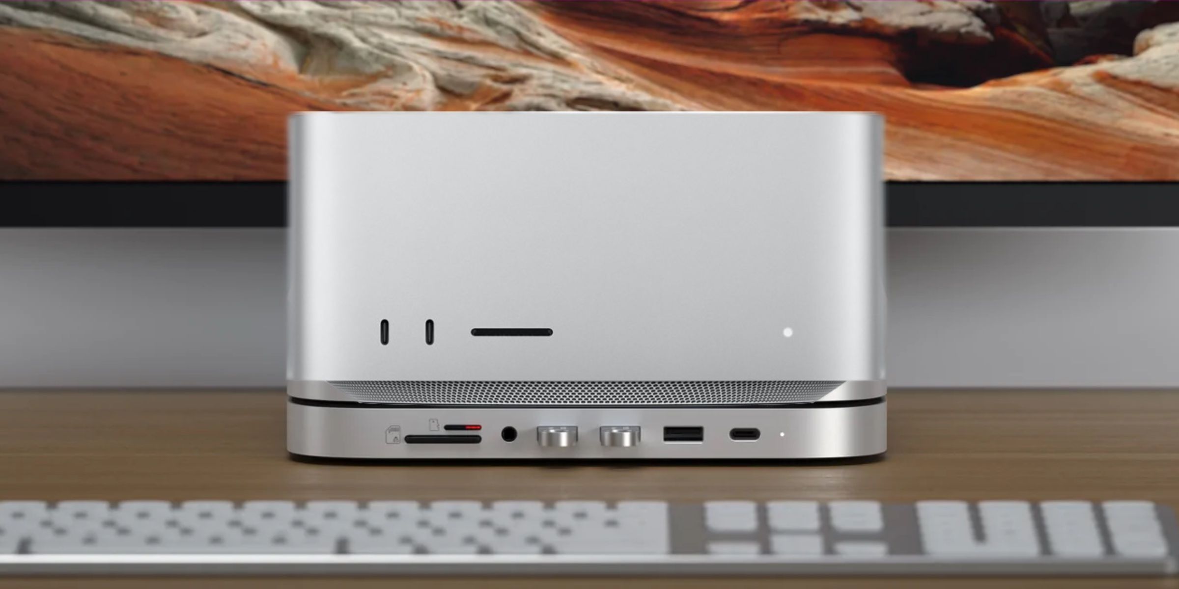 Satechi Dock under Mac Studio, which adds expanded memory and more IO ports.