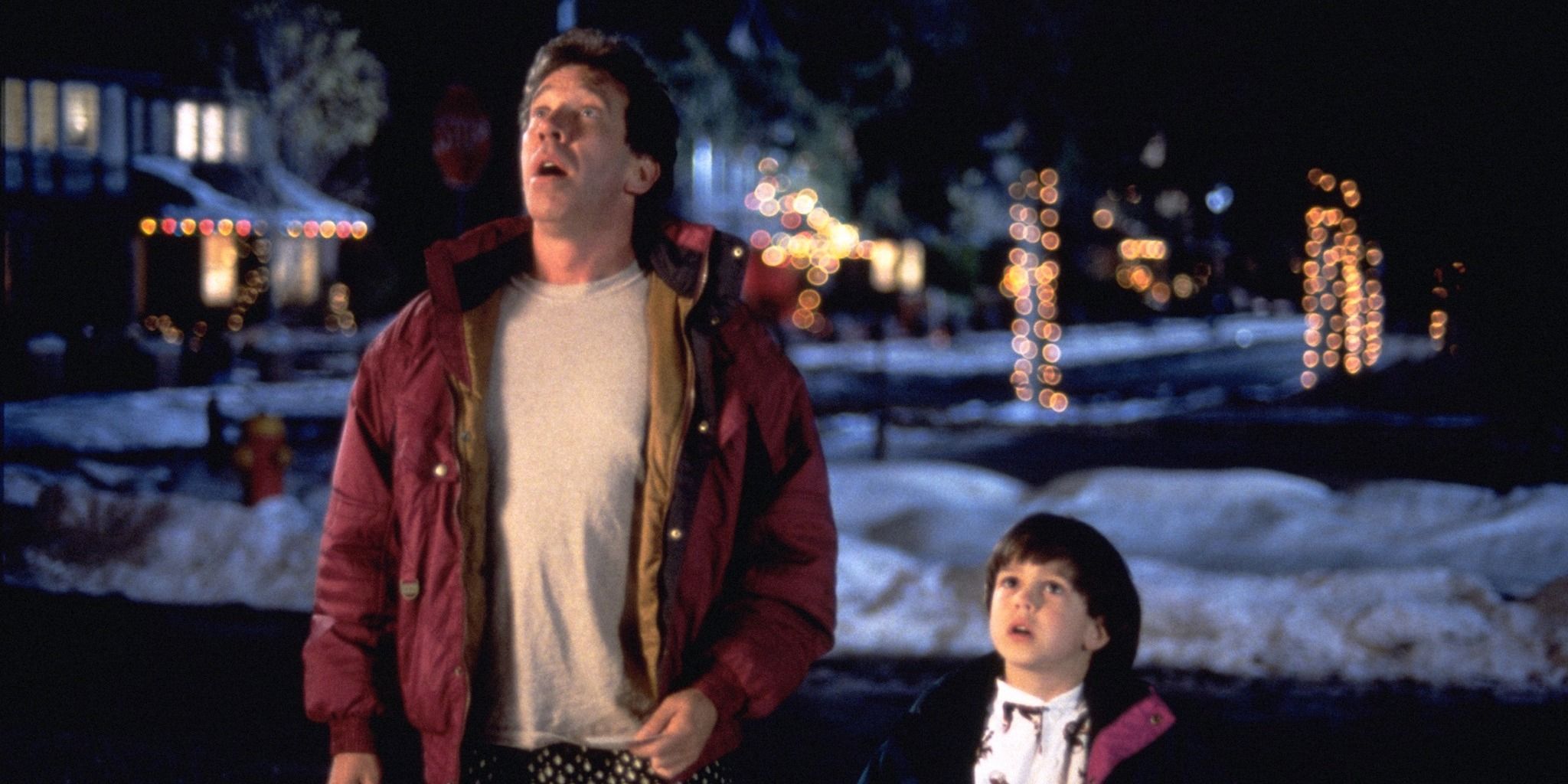 Scott and Charlie look up at Santa on the roof in The Santa Clause