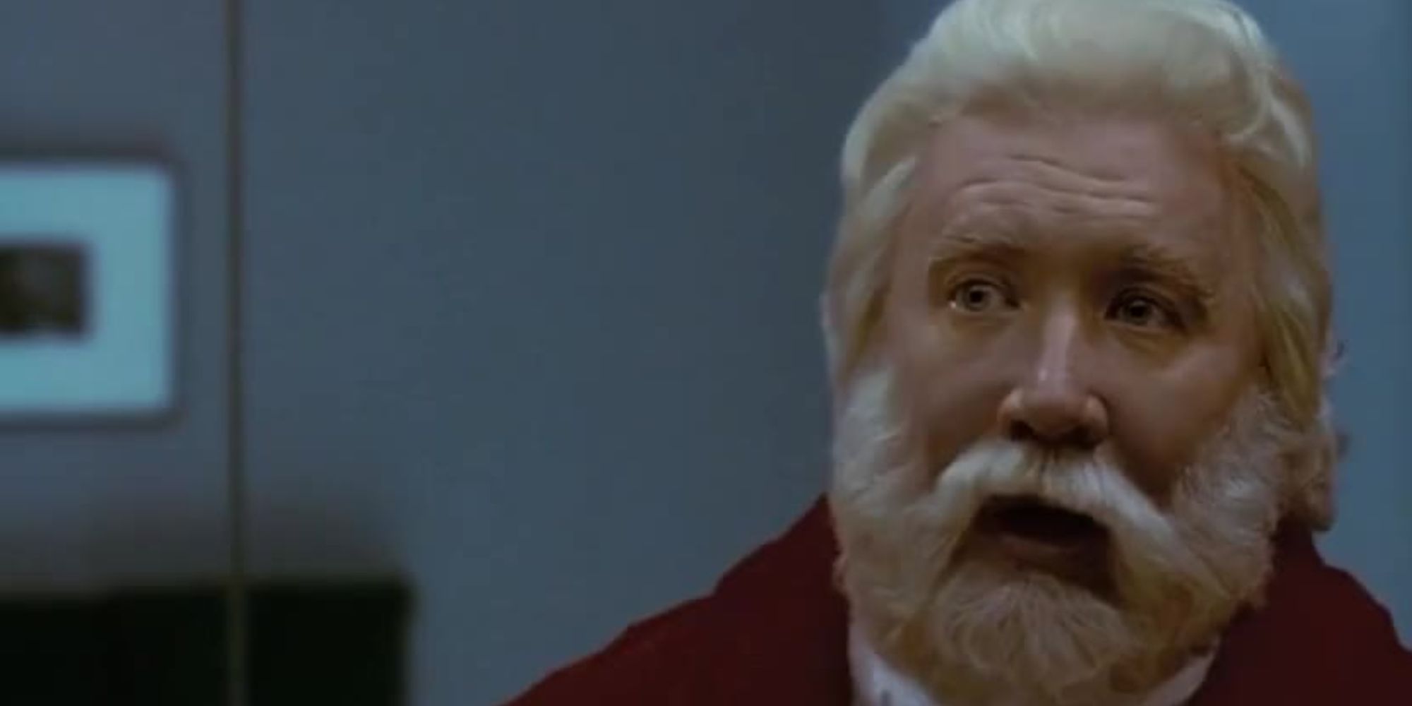 Scott looks at his beard in the mirror in The Santa Clause