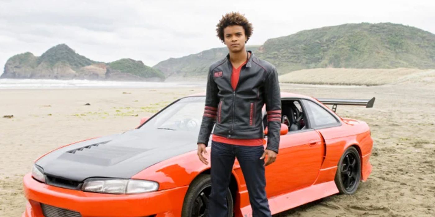 Scott standing in front of his car in Power Rangers RPM