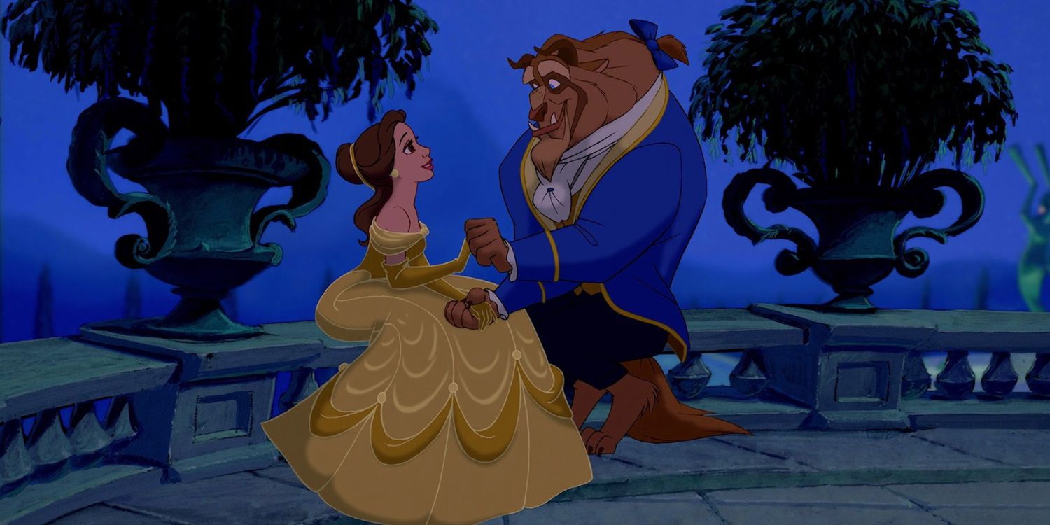 Belle and the Beast sitting outside, holding hands and staring at each other adoringly in 1991's Beauty and the Beast