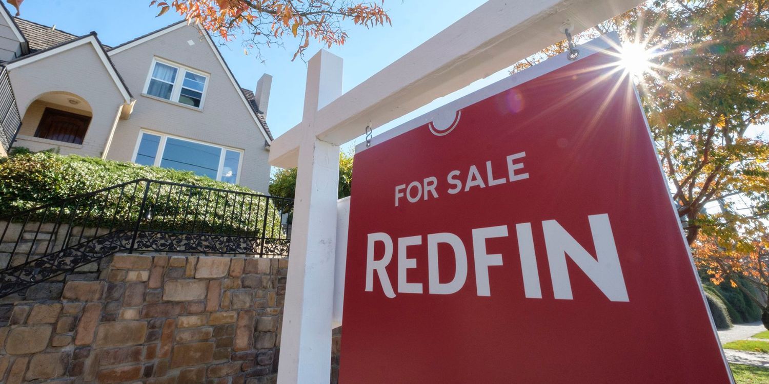 Redfin For sale sign in front of a house