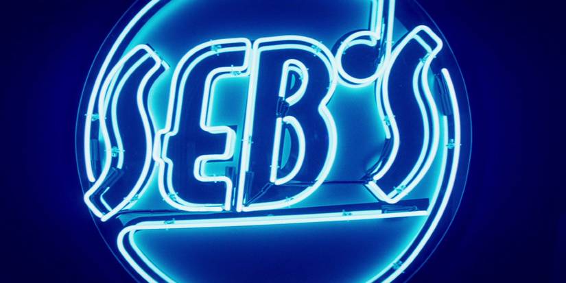 Seb's neon-lit club logo in La La Land