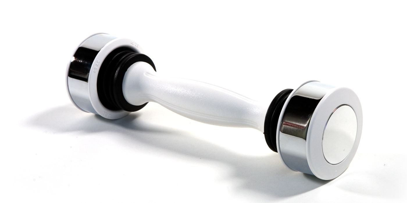 A shake weight rests atop a white surface