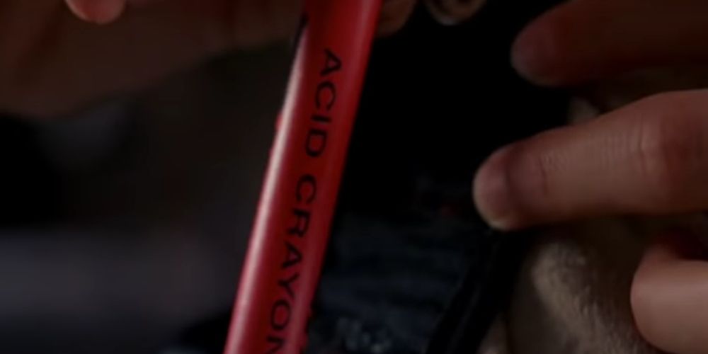 A hand holds an Acid Crayon in Spy Kids