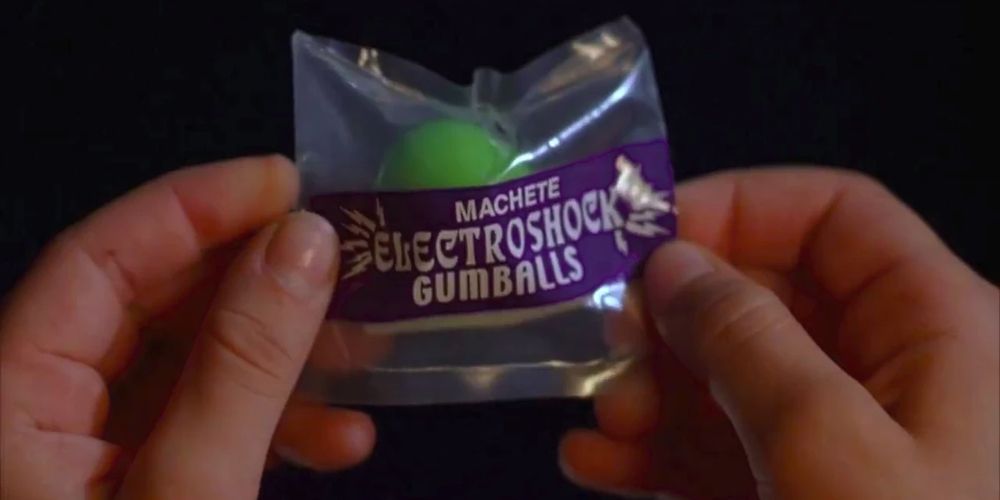 Hands hold a bag of Gumballs Electroshcok in Spy Kids