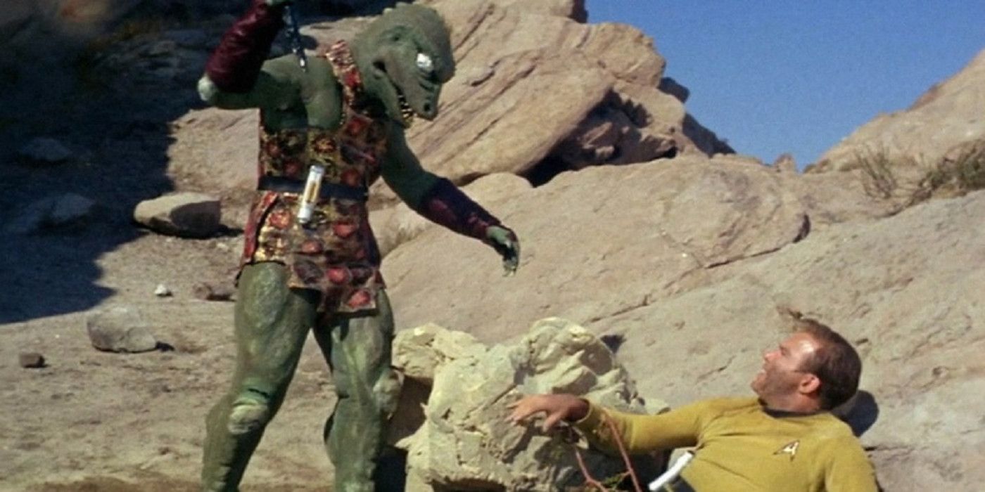 Gorn standing over Kirk in Star Trek