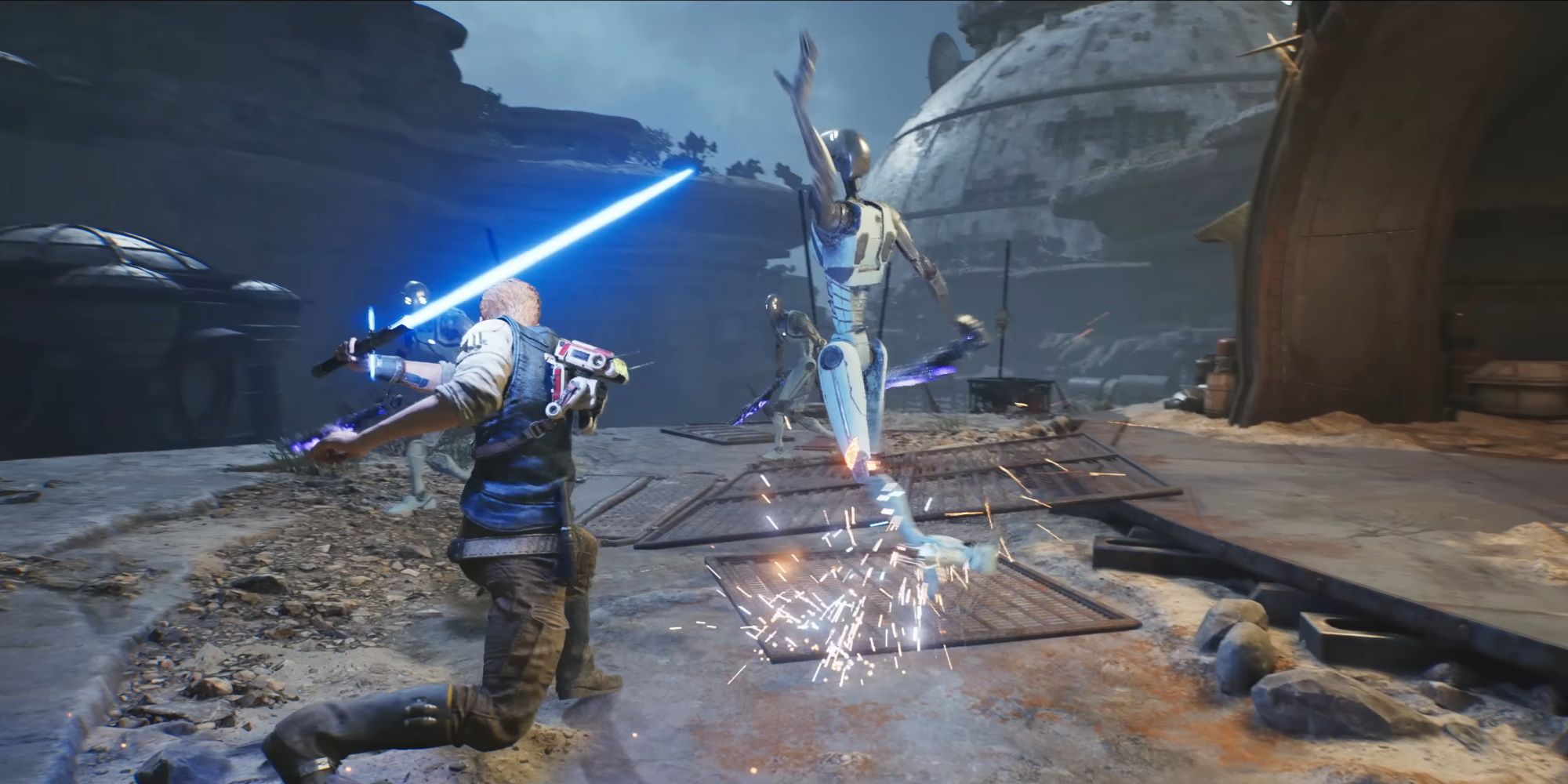 A screenshot of Star Wars Jedi: Survivor's gameplay trailer, with Cal having just sliced through the legs of a Commando Droid with his lightsaber.