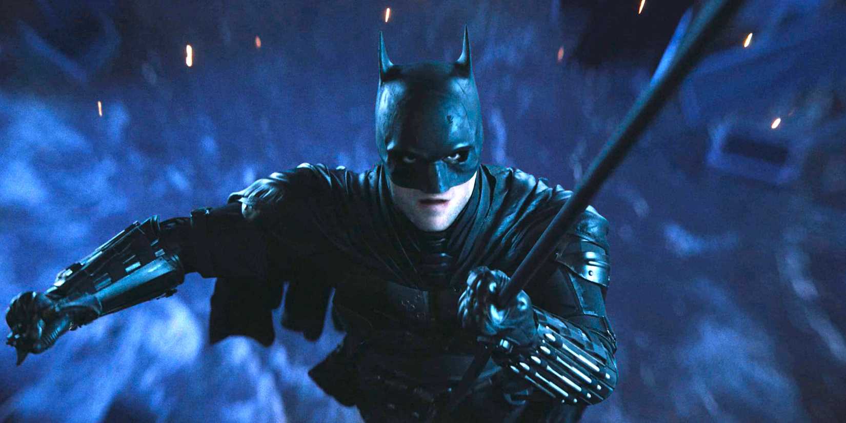 The Batman 2022 Robert Pattinson as Batman flying through the air on his grappling hook