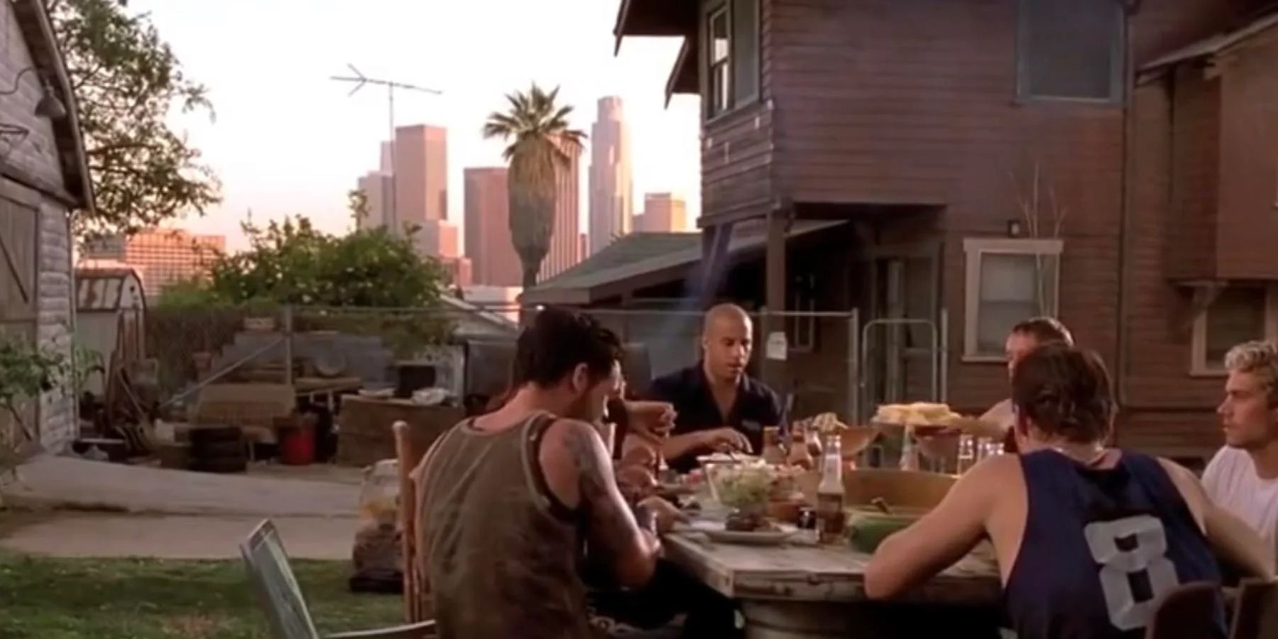 Dom and the crew having a a BBQ in the yard in The Fast and the Furious