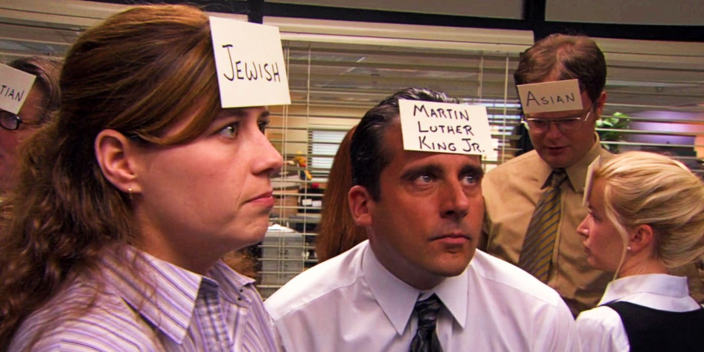 Michael (Steve Carell) pointing at a cue card that says "Martin Lither King Jr." in Diversity Day the Office