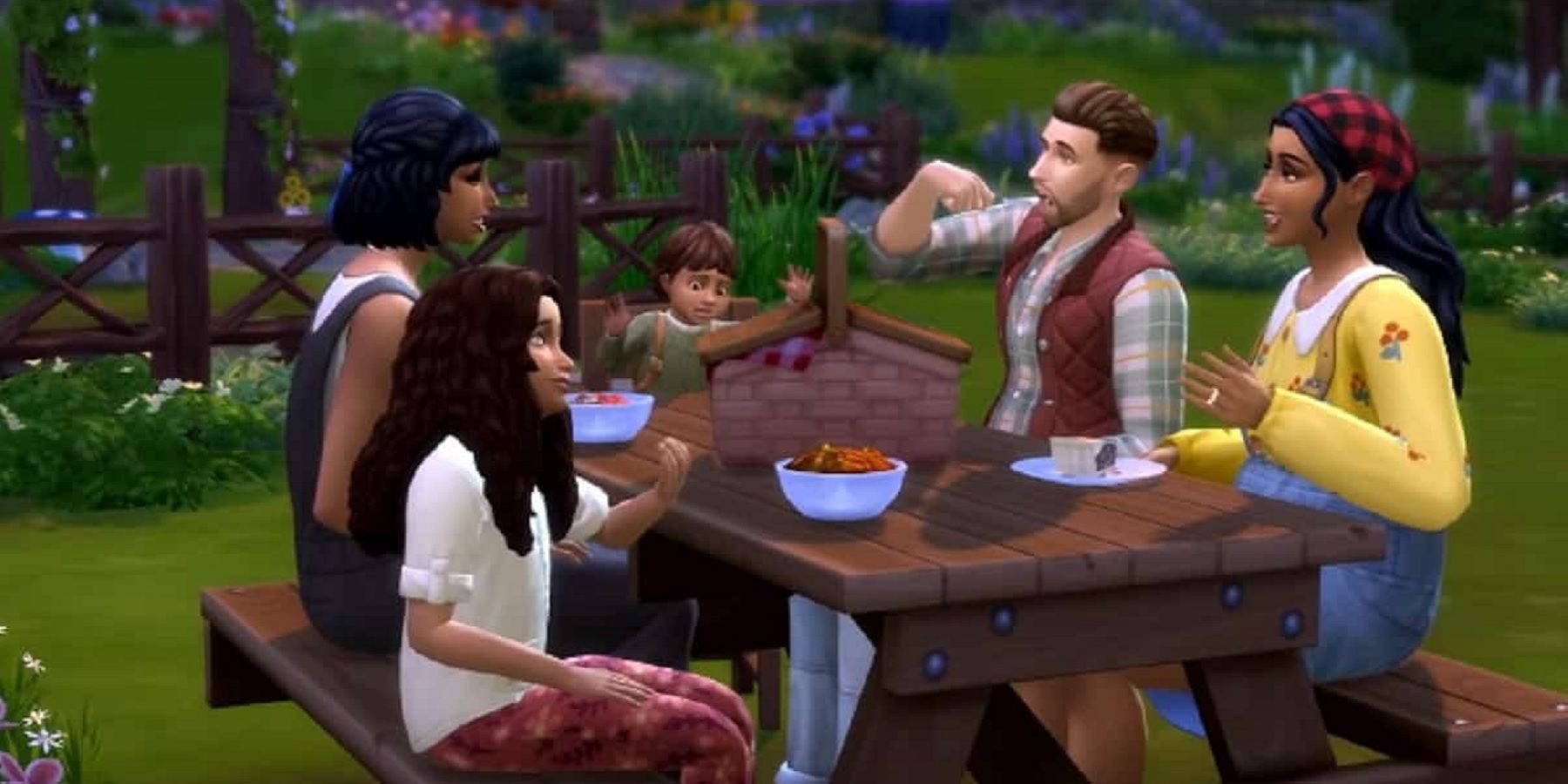 Screenshot from The Sims 4 showing five Sims eating at a picnic table.