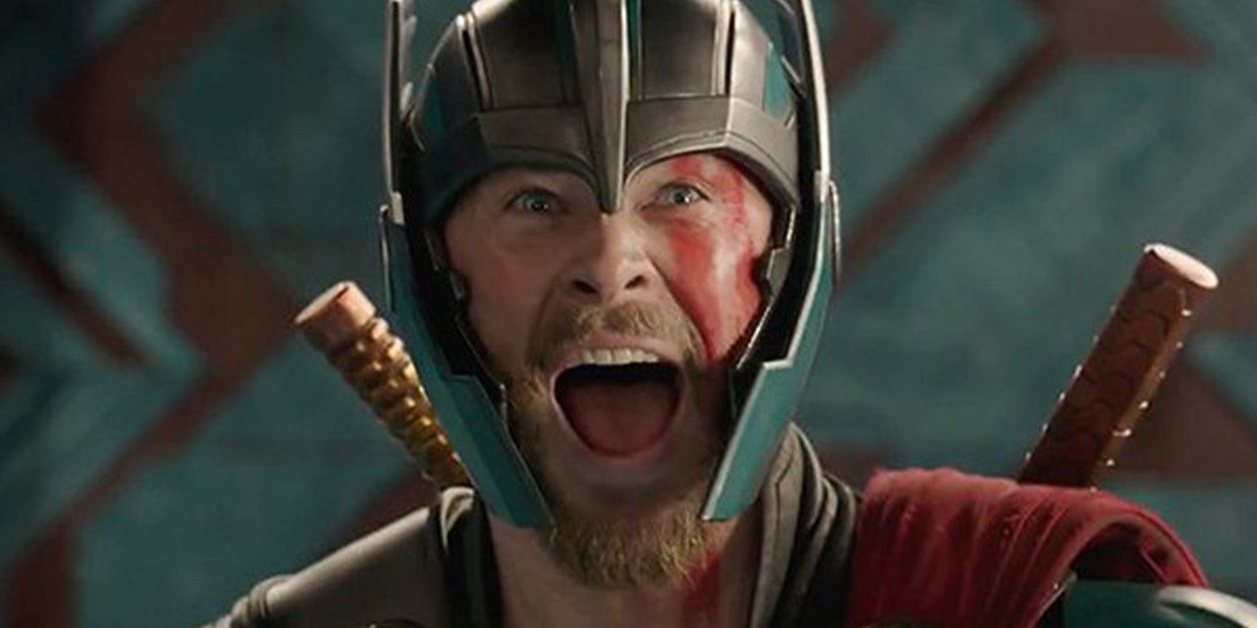 Thor screams while wearing a helmet and face paint from Thor Ragnarok 