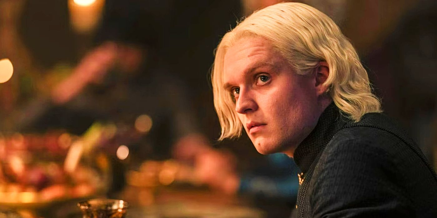 Prince Aegon Targaryen seated at a table in House of the Dragon.