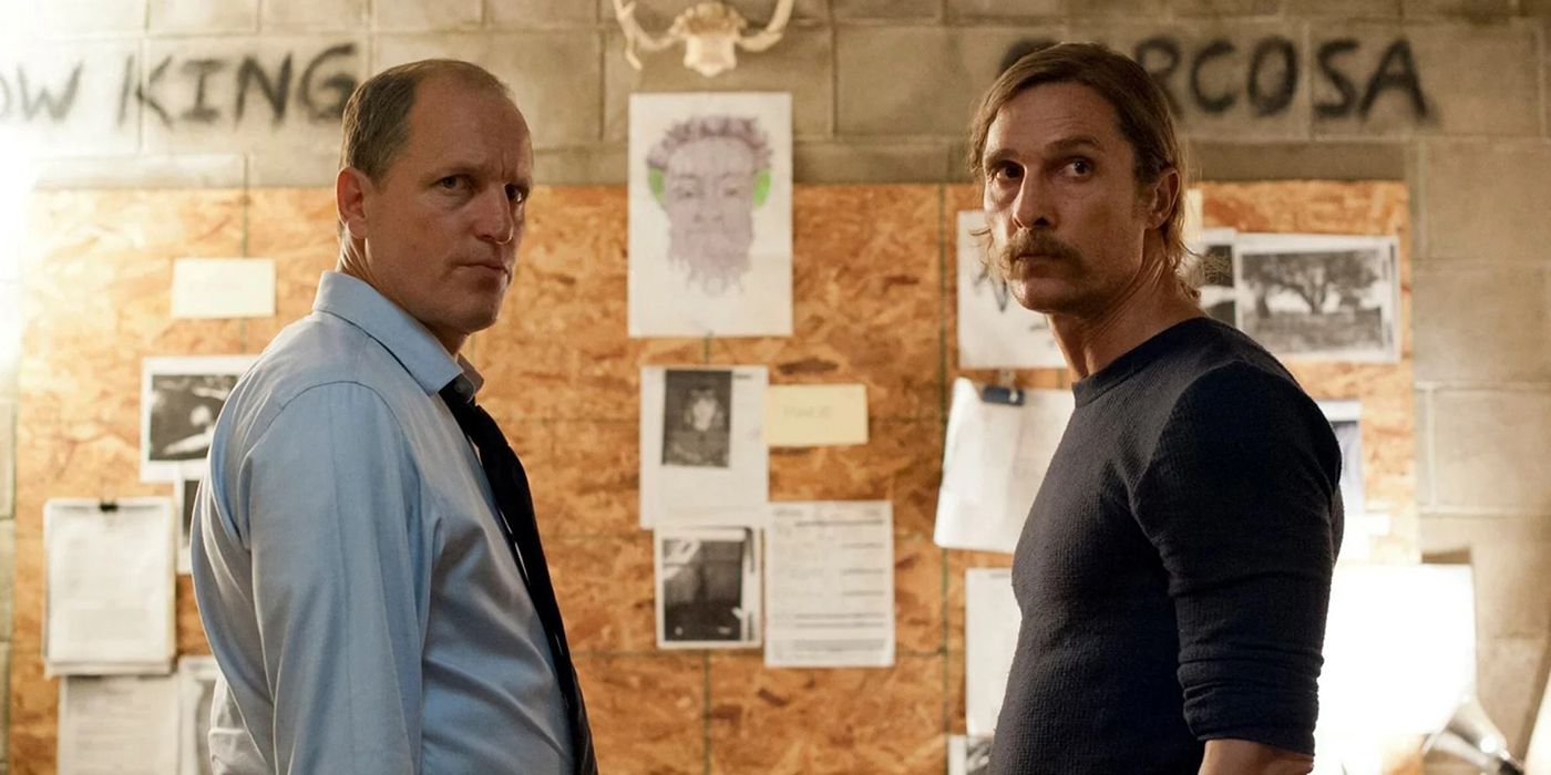 Woody Harrelson and Matthew McConaughey in season 1 of True Detective, standing face to face both looking to the side.