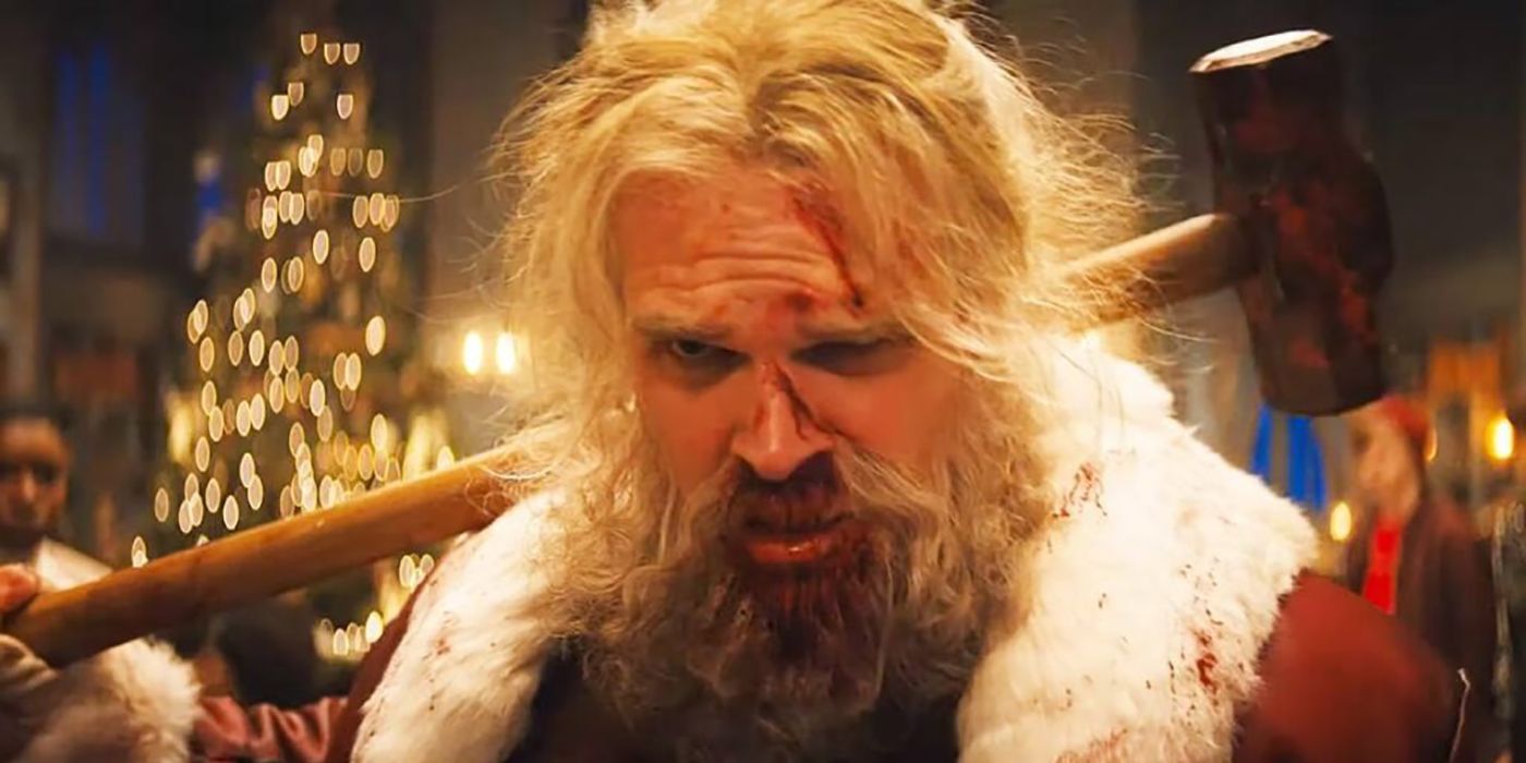 David Harbor as Santa Claus, holding a mallet in Violent Night.