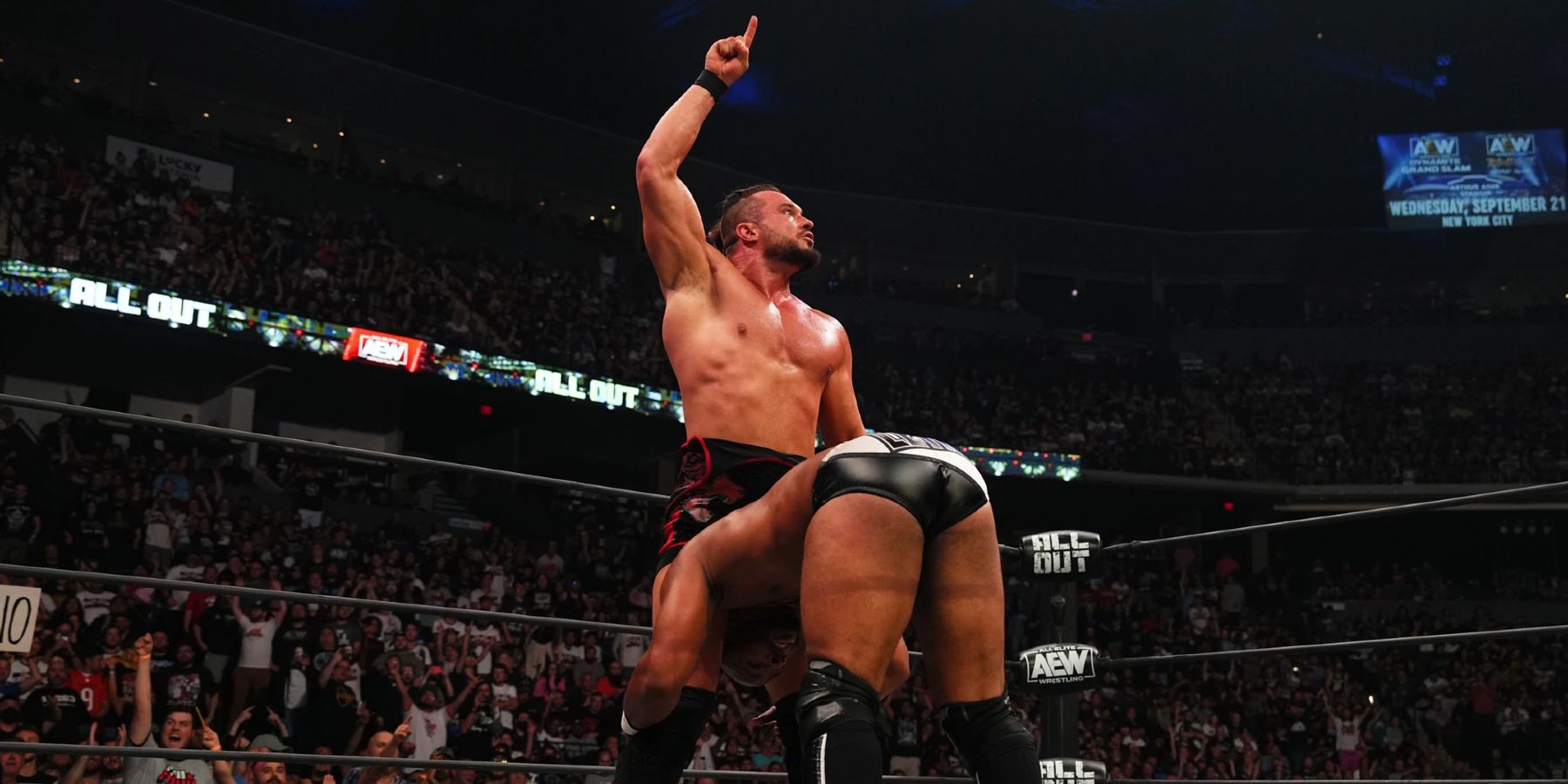 Wardlow sets up Jay Lethal for a powerbomb during AEW All Out in 2022.