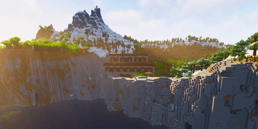 A Minecraft woodland mansion sitting on top of a cliff.