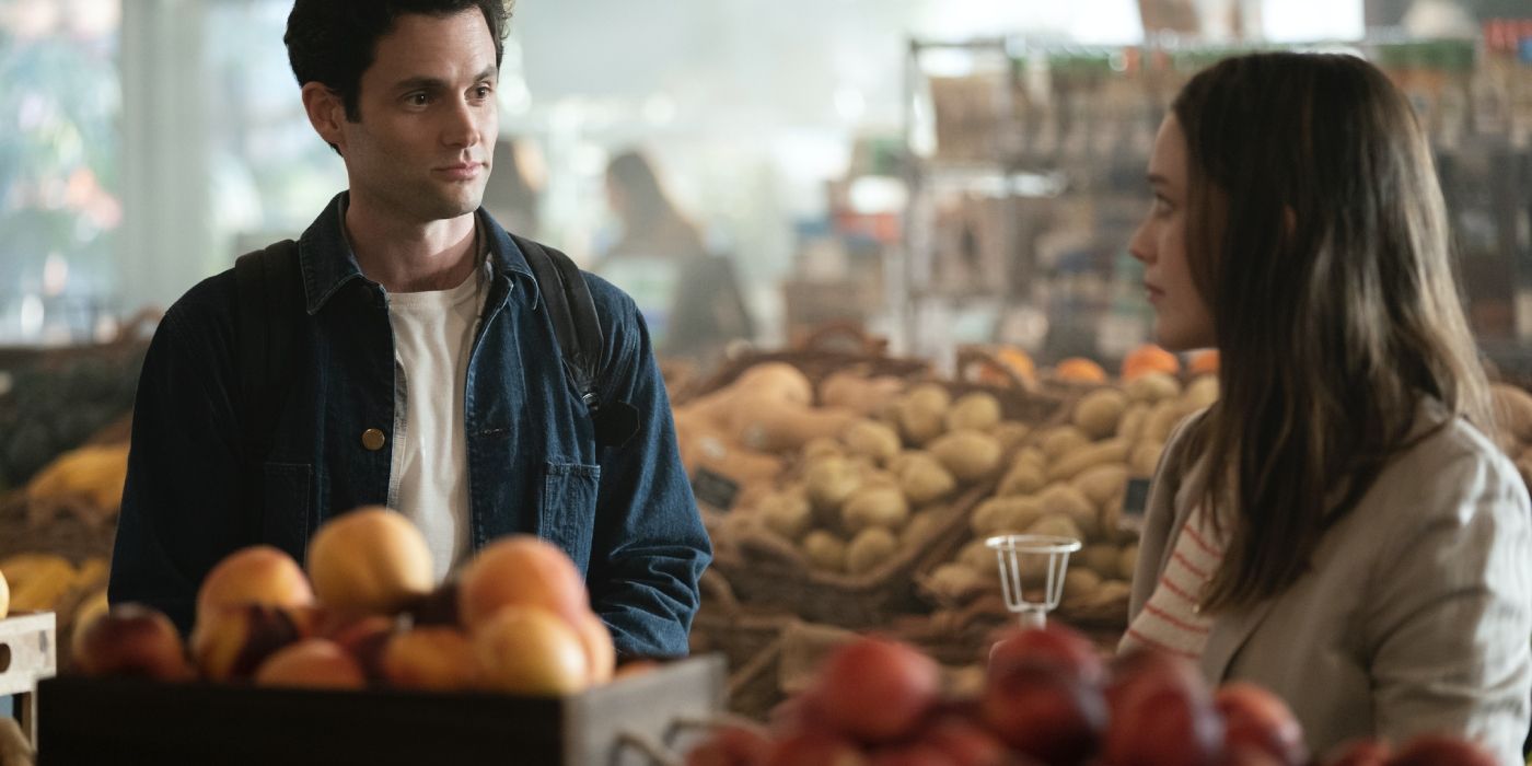 Joe and Love talking during their first meeting at a grocery store in You