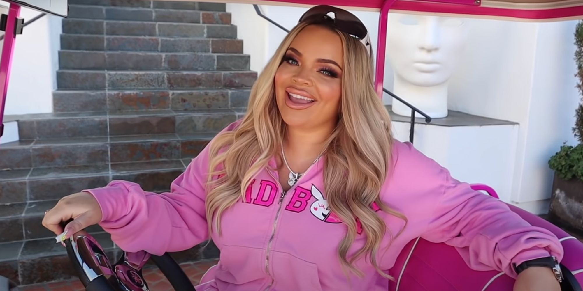 Youtuber Trisha Paytas in her pink golf cart