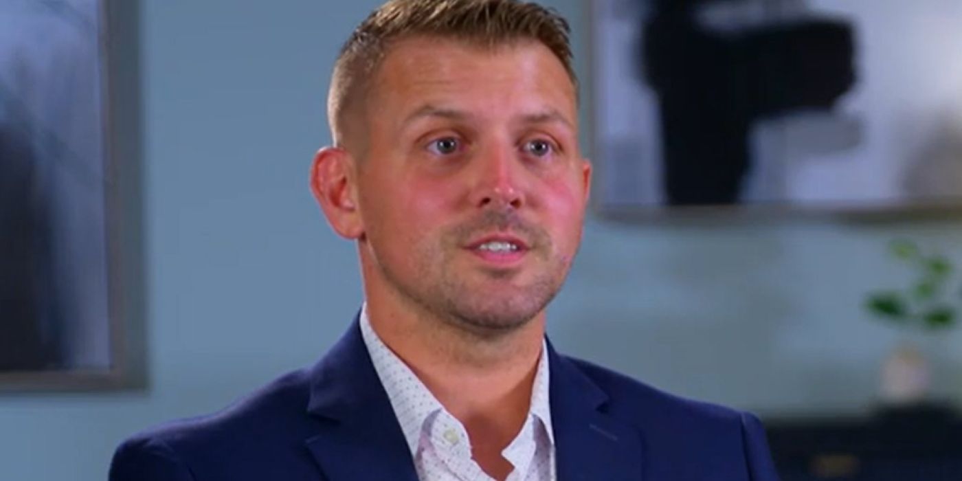 Mackinley Gilbert on Married At First Sight in a suit looking like he&rsquo;s talking
