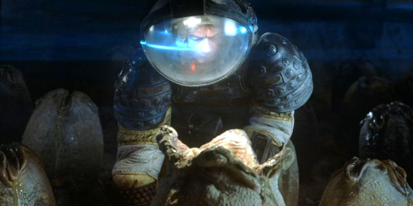 Kane (John Hurt) peering down into an egg in Alien.
