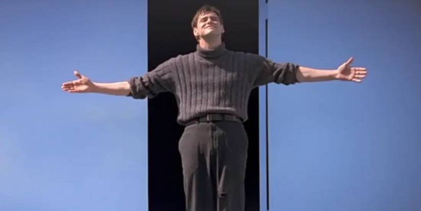 An image of Jim Carrey as Truman Burbank standing with his arms outstretched in the finale of The Truman Show