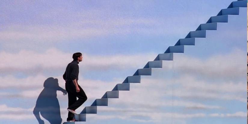 Jim Carrey as Truman Burbank climbing the stairs in The Truman show