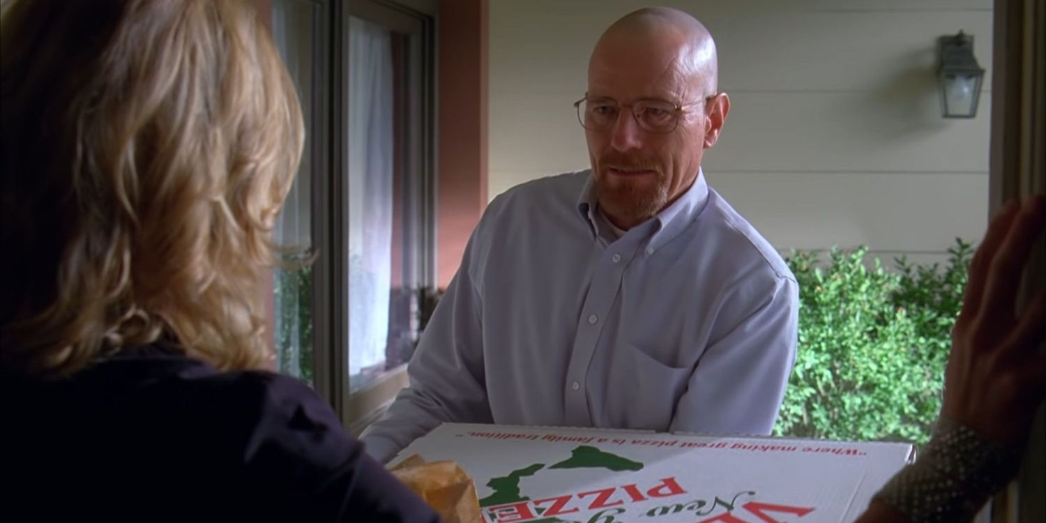 An image of Walter White holding a pizza in Breaking Bad