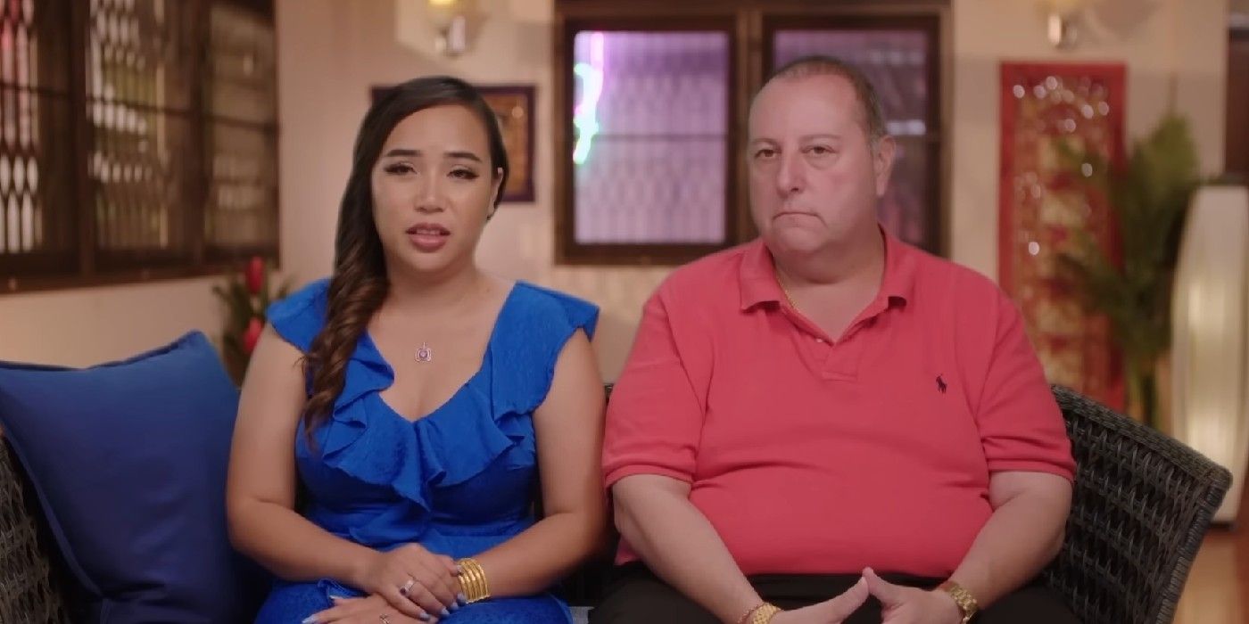 Annie David 90 Day Fiance sitting on the couch wearing bright colors