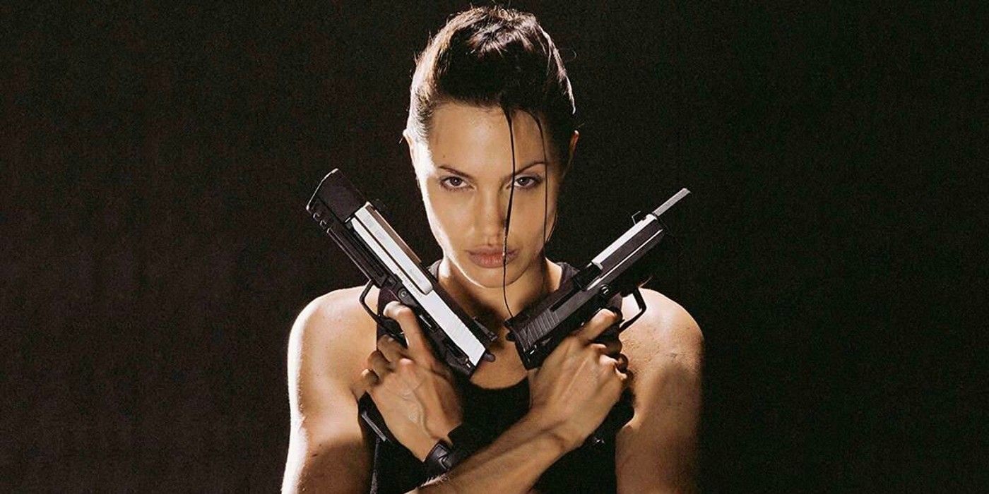 Angelina Jolie holding pistols in Lara Croft: Tomb Raider.