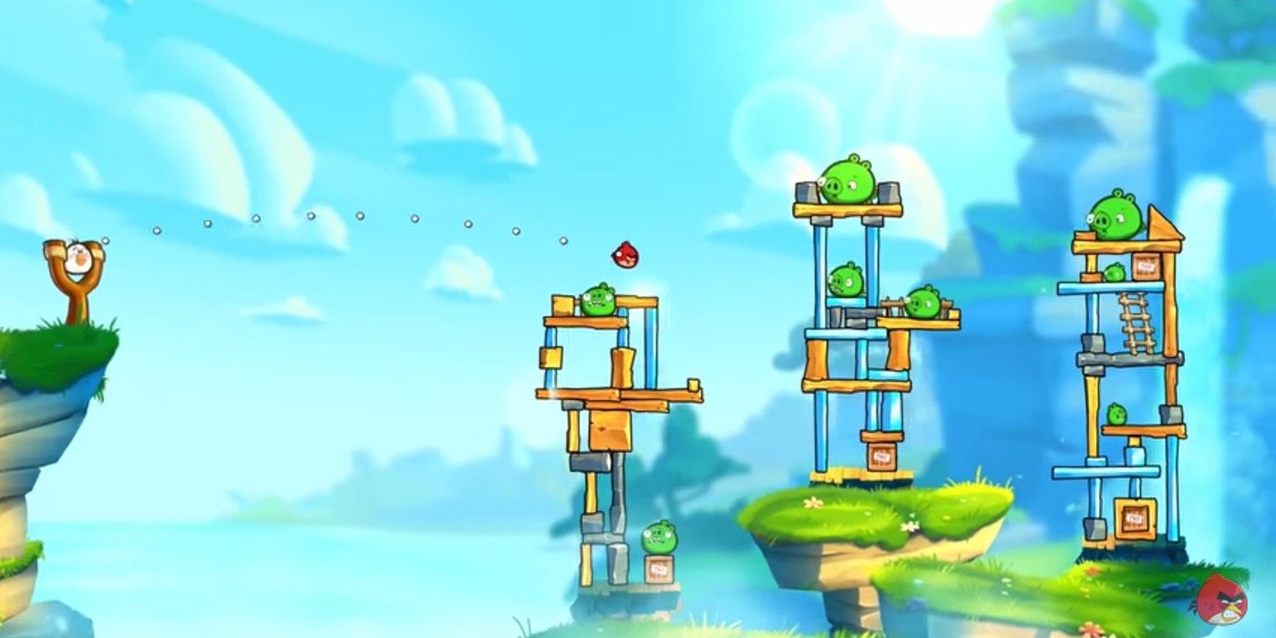 Uma imagem da jogabilidade de Angry Birds mostrando um pássaro prestes a ser lançado em porcos.