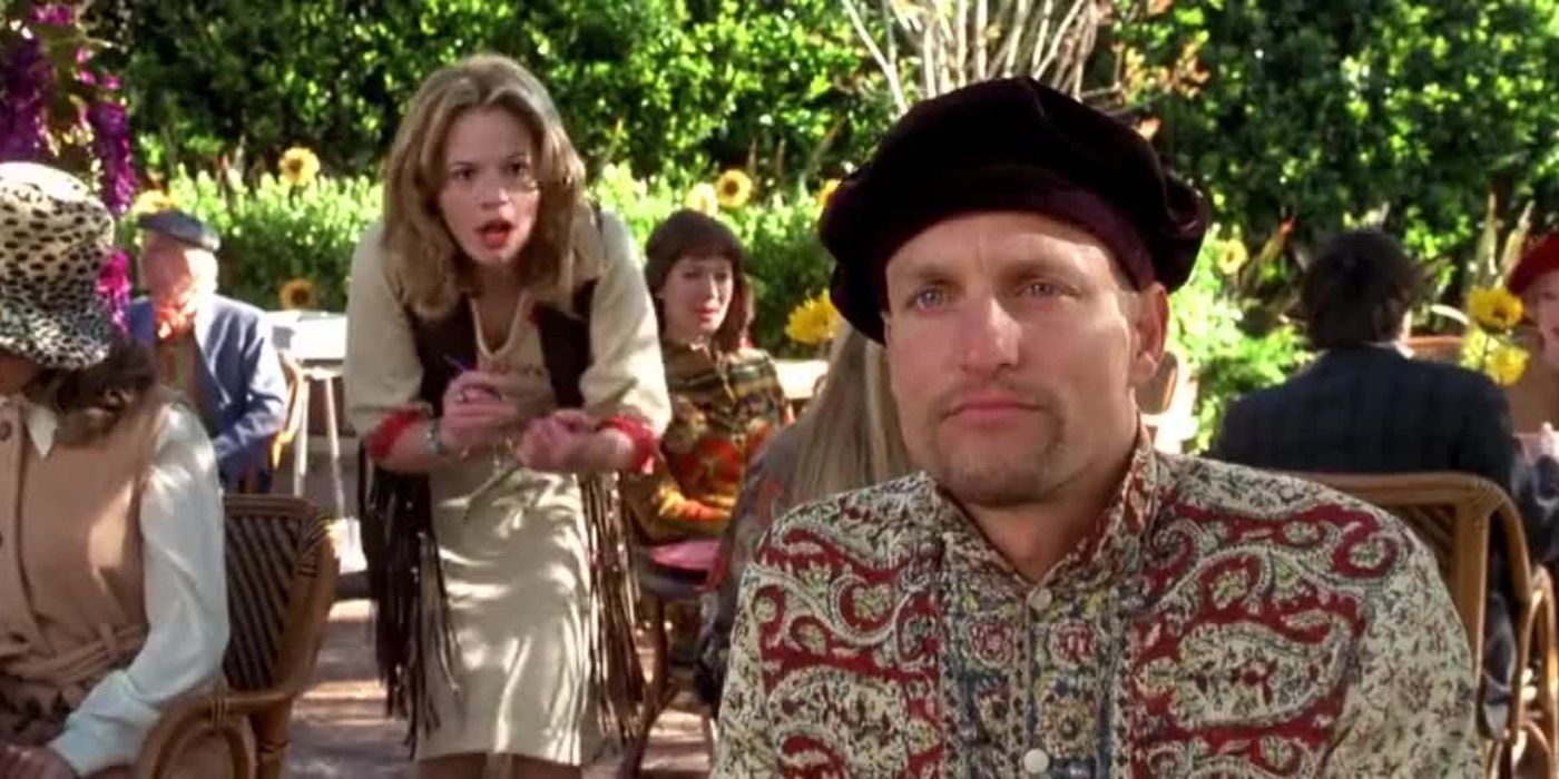 Woody Harrelson looks on as a fan approaches him from Austin Powers 