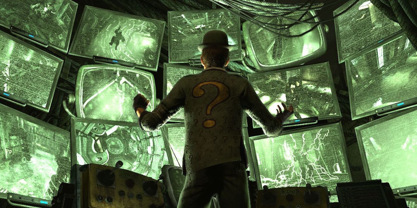 The Riddler watches a large bank of green surveillance cameras in Batman: Arkham City