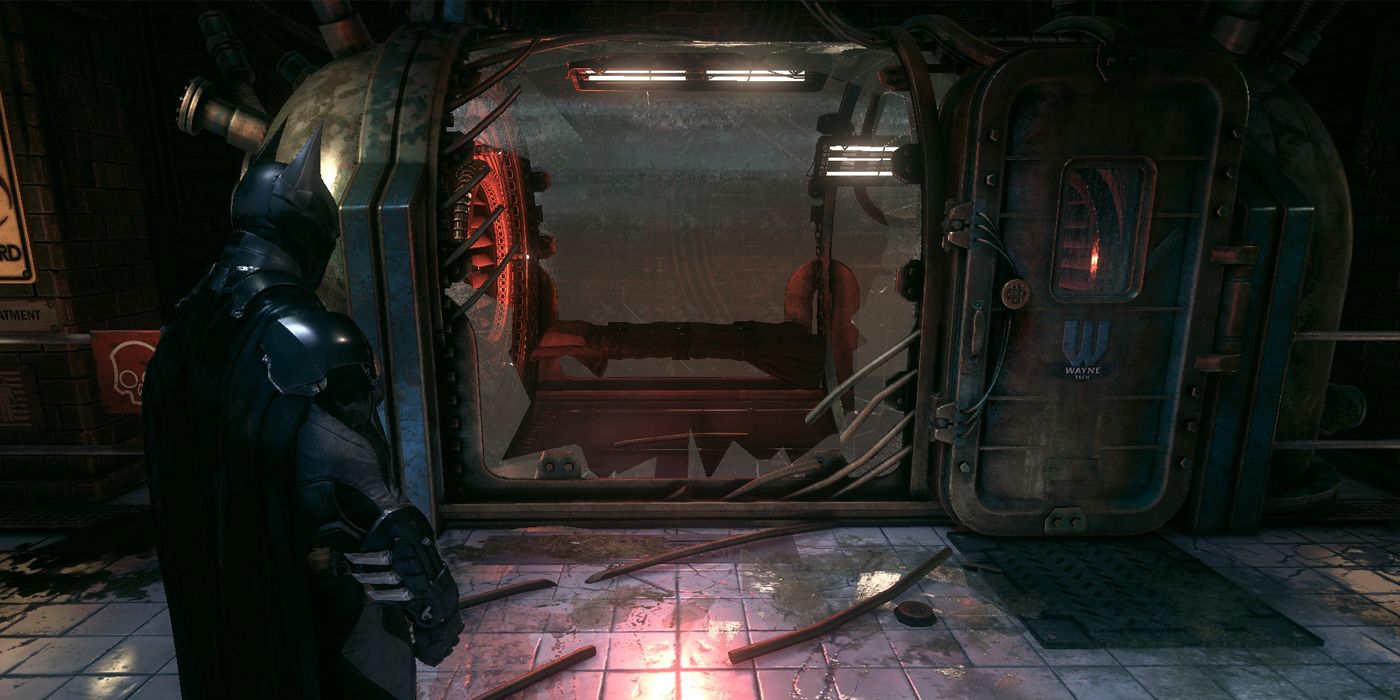 Batman standing in front of Man-Bat's holding cell in the GCPD in Batman: Arkham Knight. The cell's been broken open and Man-Bat is nowhere to be seen.