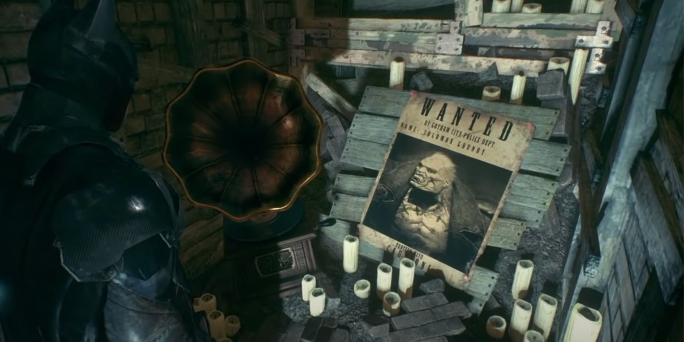 Batman looks at a shrine to Solomon Grundy, whose Wanted poster is surrounded by candles and a gramophone that plays his nursery rhyme in Batman: Arkham Knight
