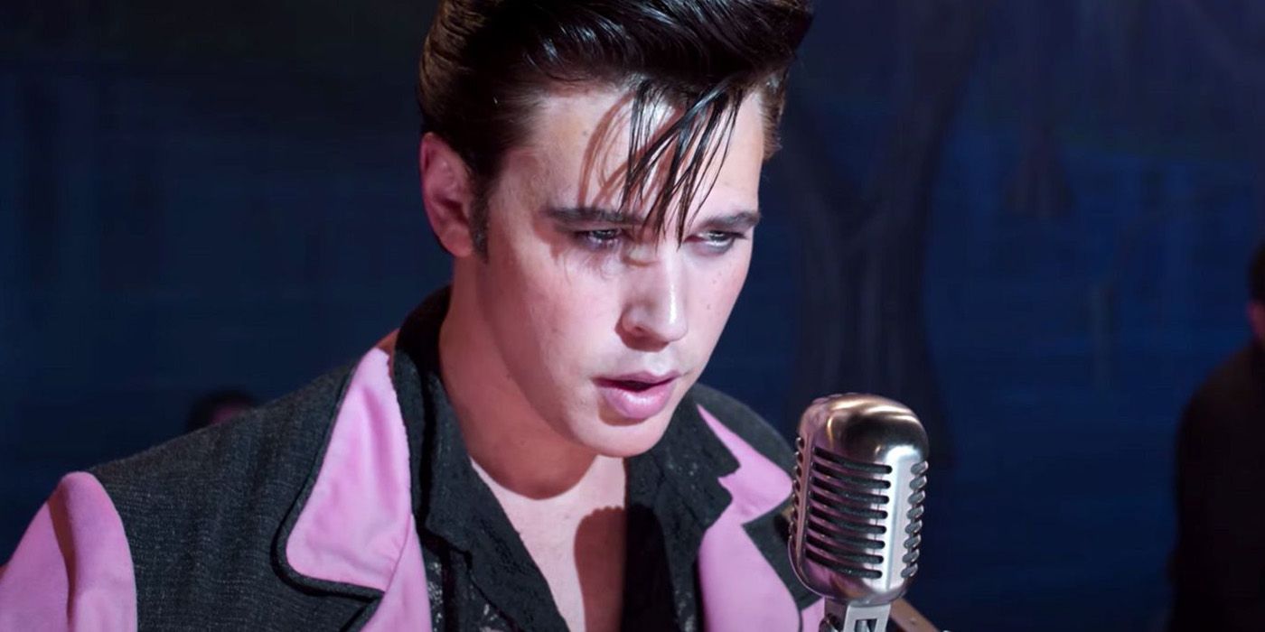 Austin Butler standing at a microphone in Elvis